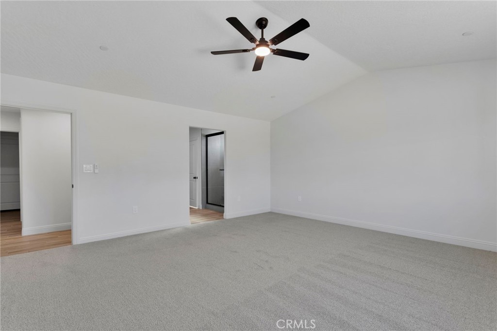 9432 Wasco Hesperia, CA 92345 - Photo 22 of 45 an empty room with a ceiling fan and a window