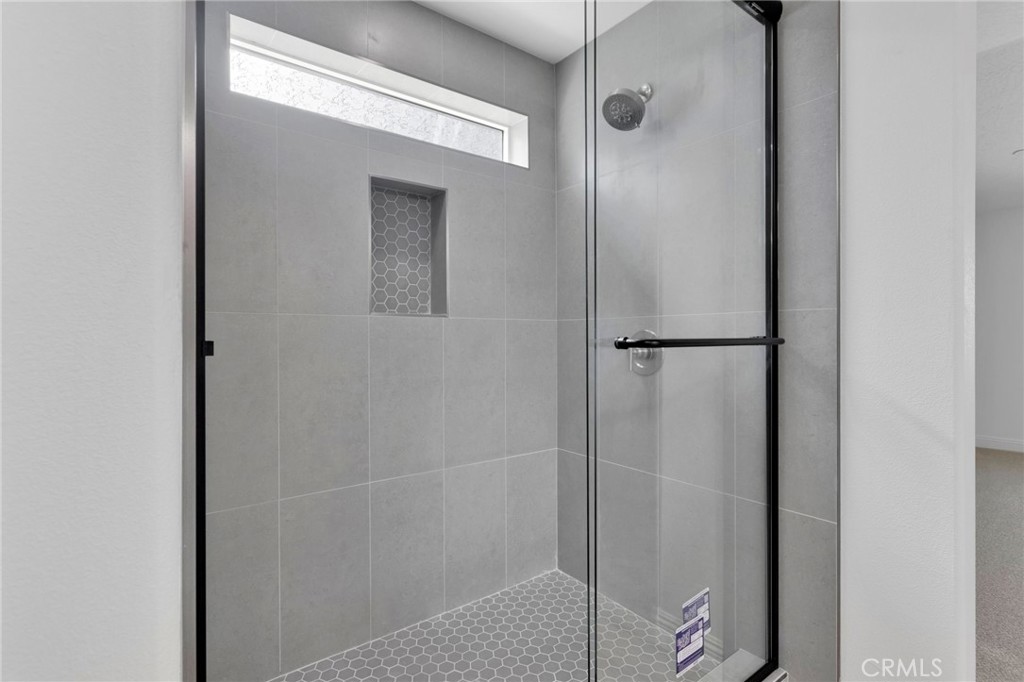 9432 Wasco Hesperia, CA 92345 - Photo 26 of 45 a bathroom with a glass shower door