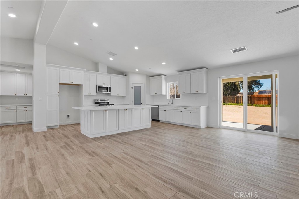 9432 Wasco Hesperia, CA 92345 - Photo 4 of 45 a view of kitchen with wooden floor