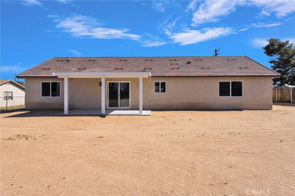 9432 Wasco Hesperia, CA 92345 - Photo 41 of 45 a front view of a house with a yard