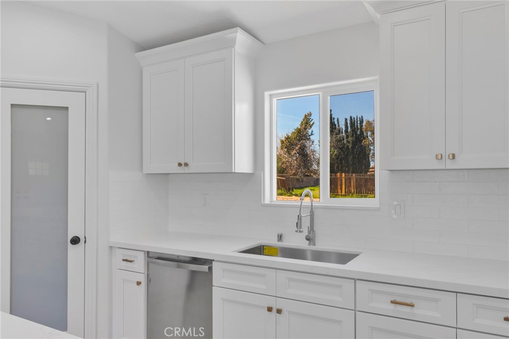 9432 Wasco Hesperia, CA 92345 - Photo 8 of 45 a kitchen with a sink and cabinets