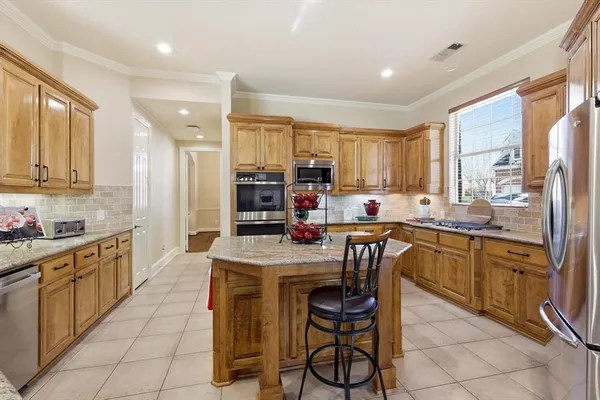 a kitchen with sink cabinets and window
