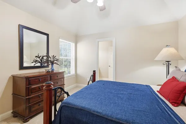 a living room with furniture a rug and a window