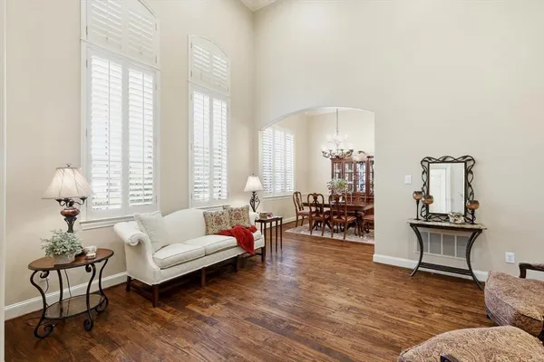 a living room with furniture and a lamp