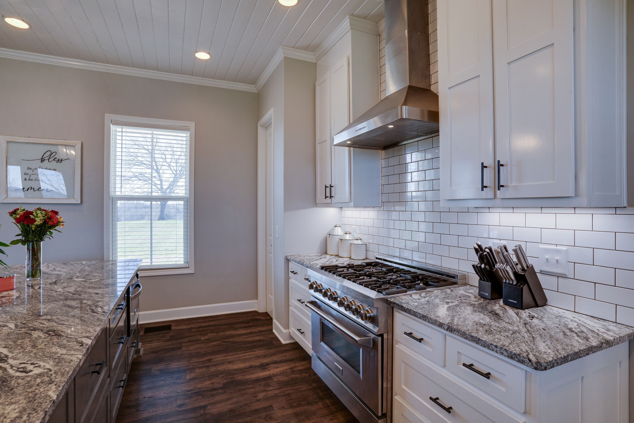 295 Ben Armstrong Road Castalian Springs, TN 37031 - Photo 13 of 44 a kitchen with granite countertop a sink a stove and cabinets
