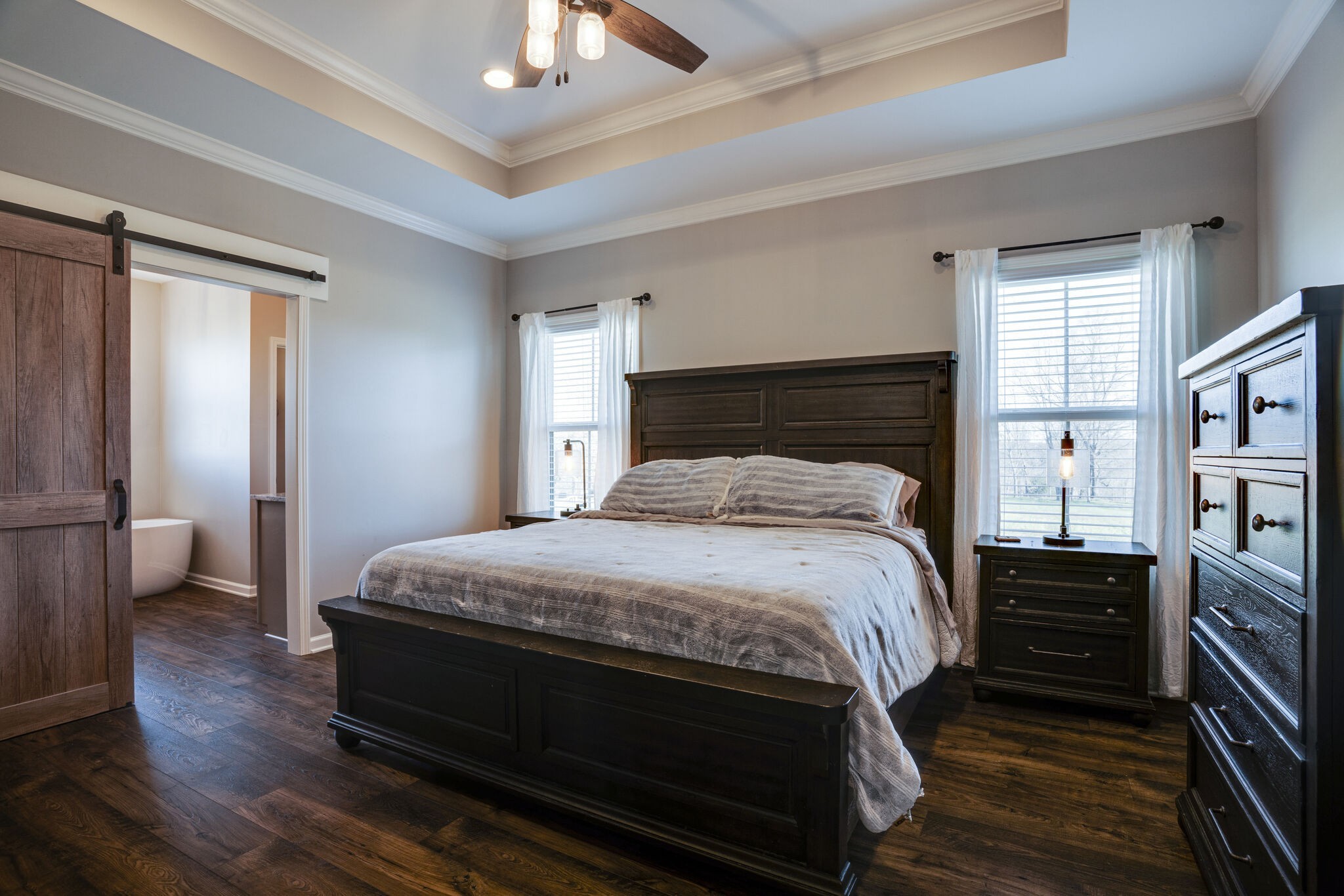 295 Ben Armstrong Road Castalian Springs, TN 37031 - Photo 20 of 44 a bedroom with a bed a dresser and book shelf