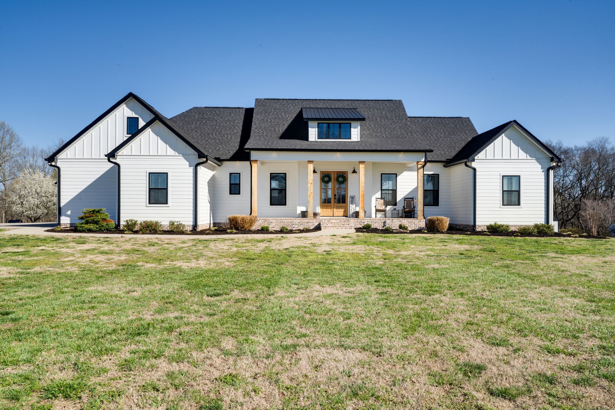 295 Ben Armstrong Road Castalian Springs, TN 37031 - Photo 2 of 44 a front view of house with yard and seating area