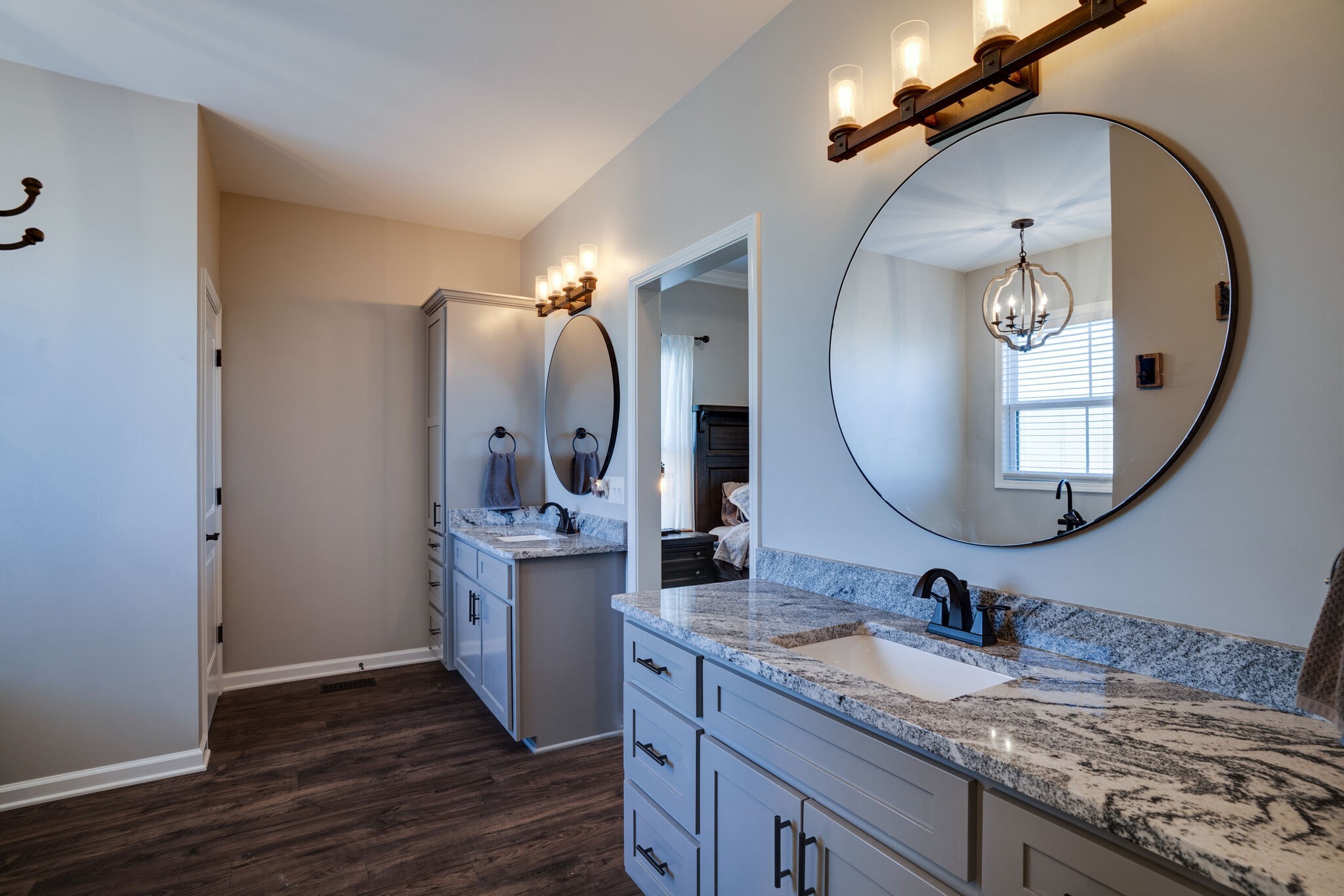 295 Ben Armstrong Road Castalian Springs, TN 37031 - Photo 22 of 44 a bathroom with a granite countertop double vanity sink and a mirror