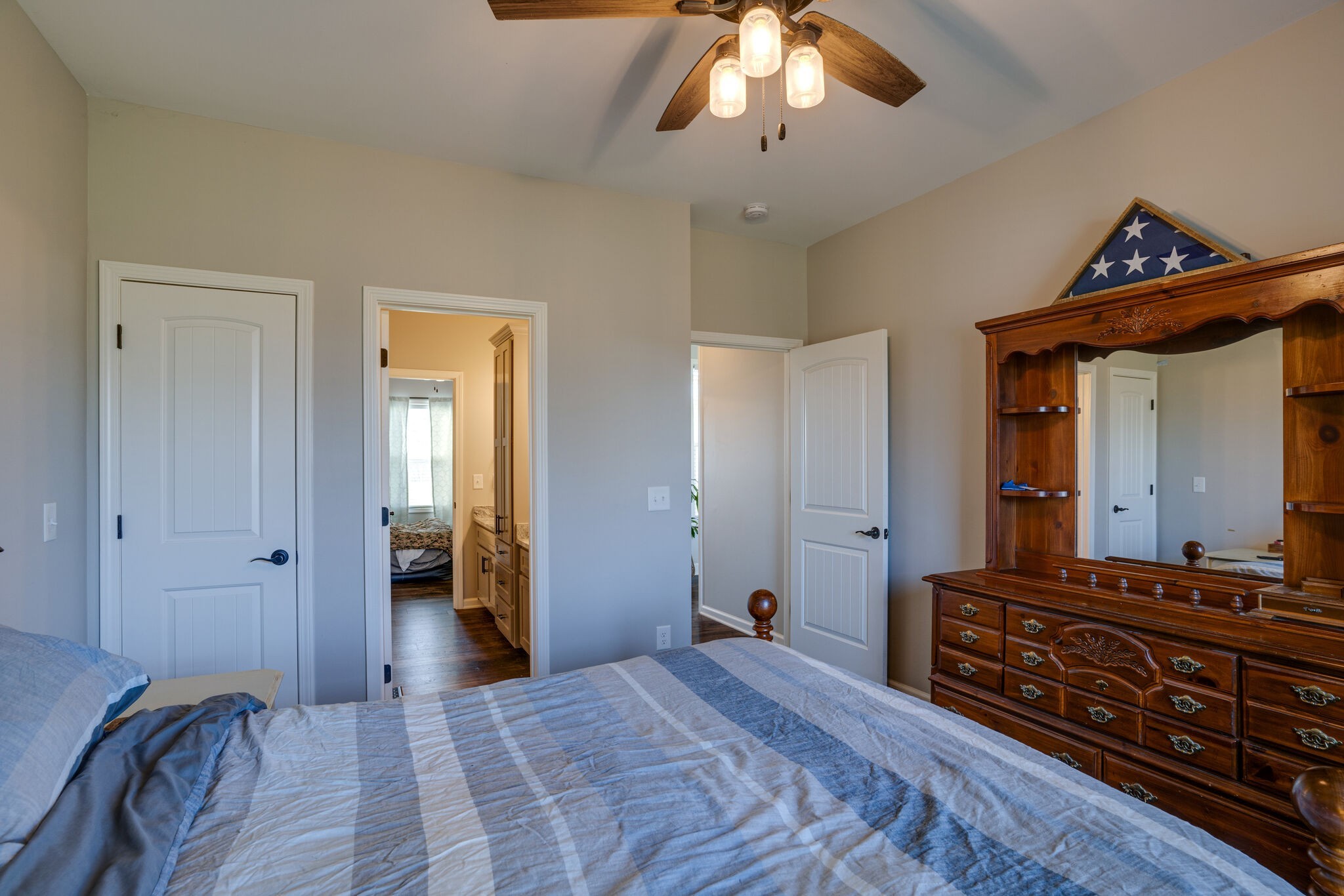 295 Ben Armstrong Road Castalian Springs, TN 37031 - Photo 28 of 44 a bedroom with a bed and a chandelier