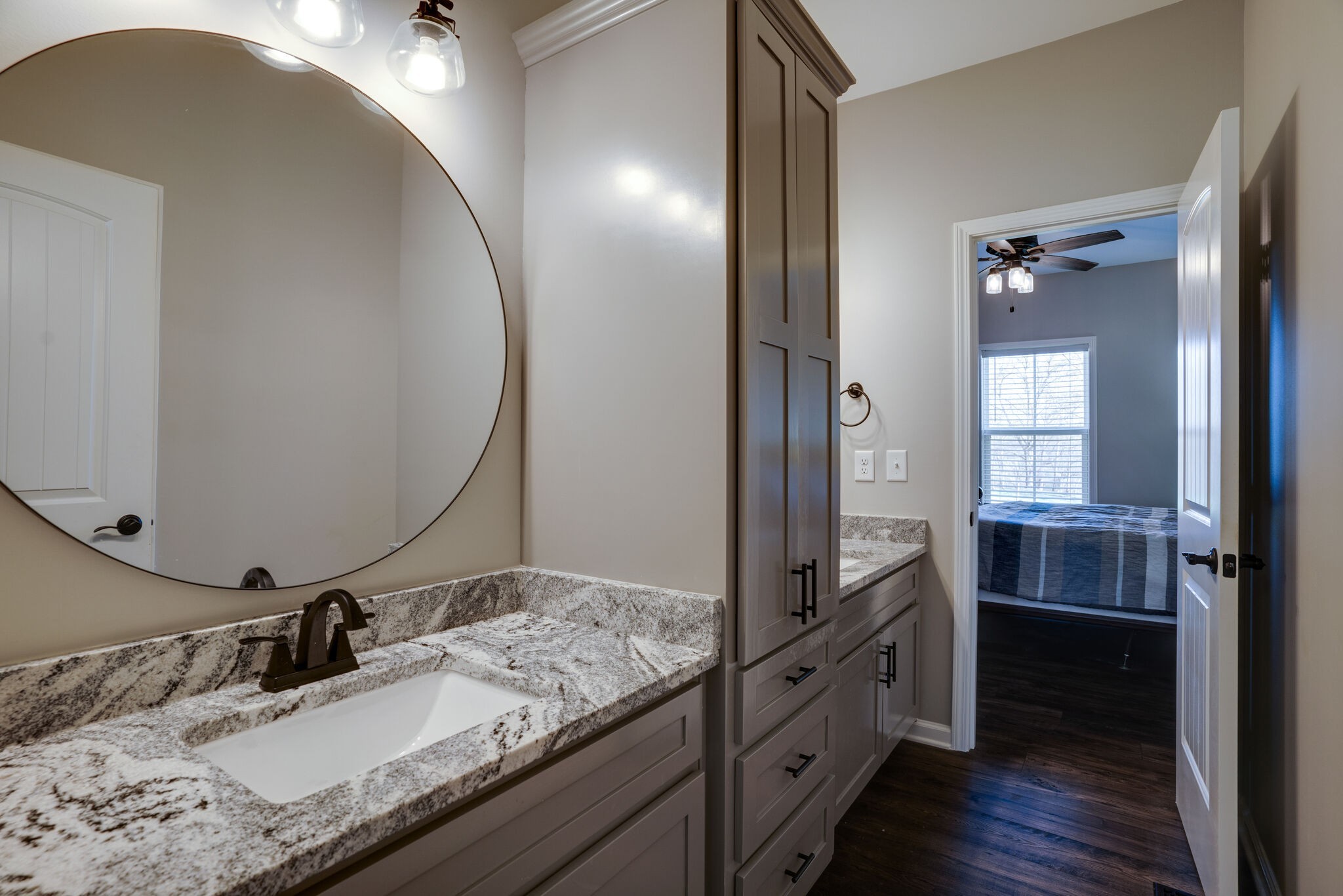 295 Ben Armstrong Road Castalian Springs, TN 37031 - Photo 29 of 44 a bathroom with a granite countertop sink and a mirror