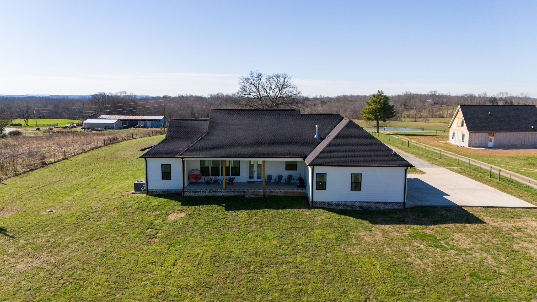 295 Ben Armstrong Road Castalian Springs, TN 37031 - Photo 38 of 44 an aerial view of a house with a garden and lake view
