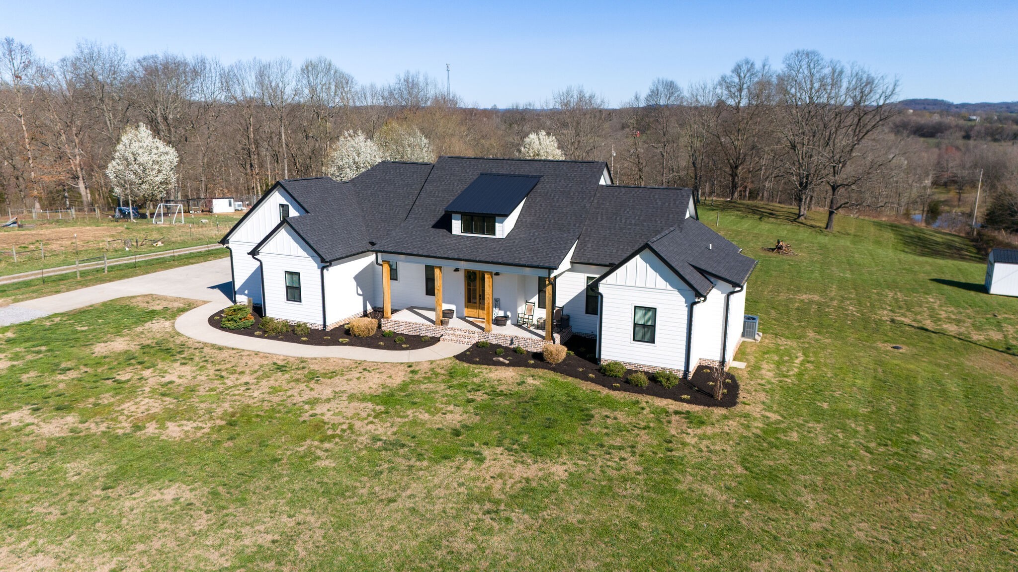 295 Ben Armstrong Road Castalian Springs, TN 37031 - Photo 4 of 44 a aerial view of a house with table and chairs in it