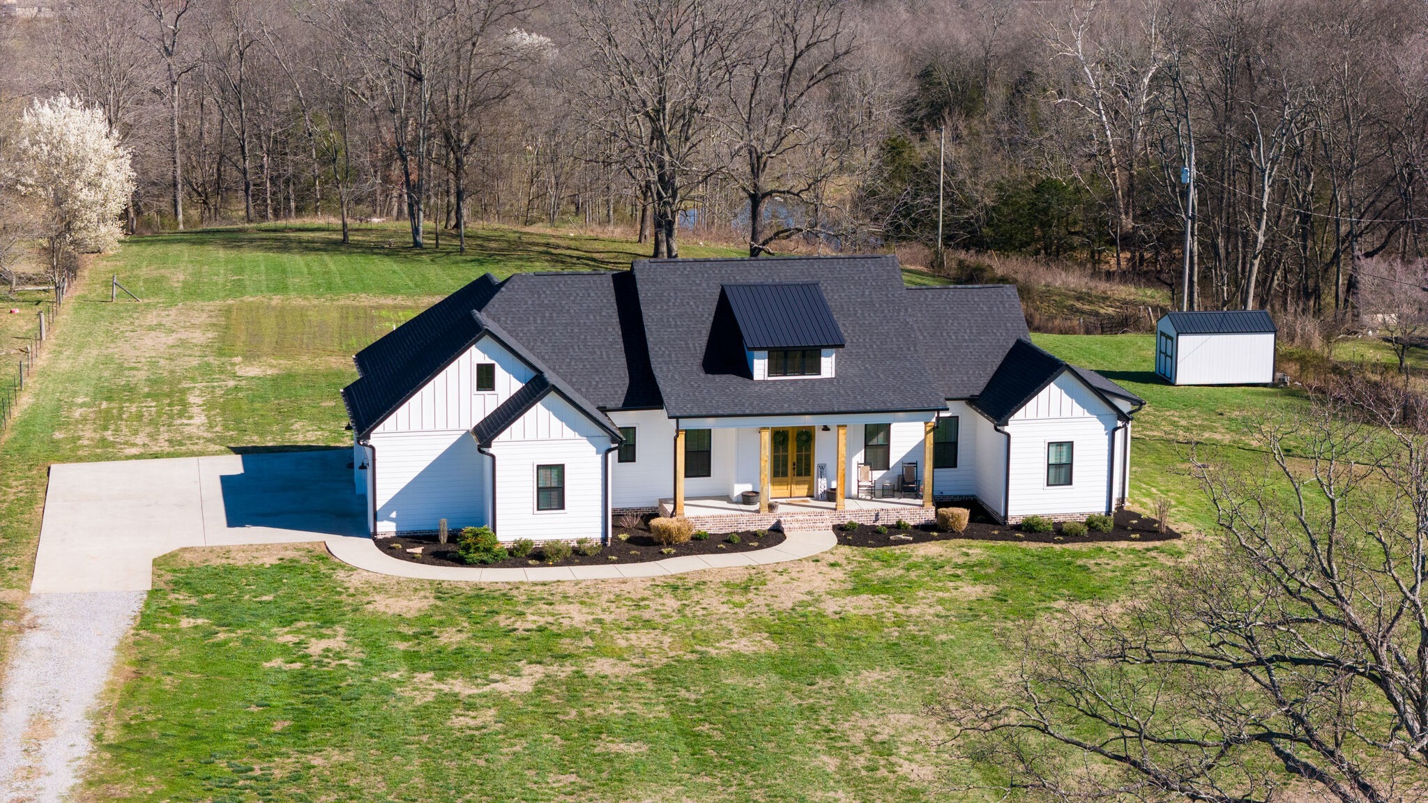 295 Ben Armstrong Road Castalian Springs, TN 37031 - Photo 5 of 44 a front view of house with yard and trees in the background