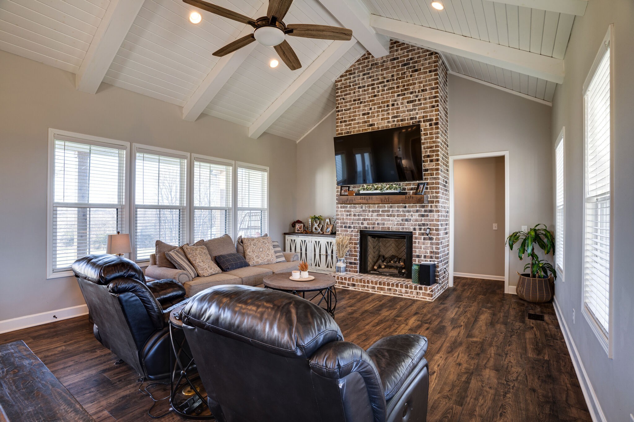 295 Ben Armstrong Road Castalian Springs, TN 37031 - Photo 9 of 44 a living room with furniture a fireplace and a flat screen tv