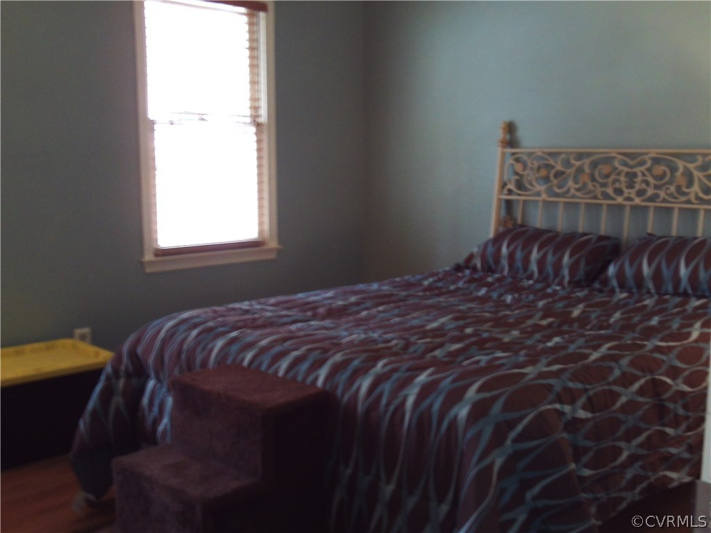 7029 Pointer Ridge Road Midlothian, VA 23112 - Photo 12 of 27 a bedroom with a bed and a window