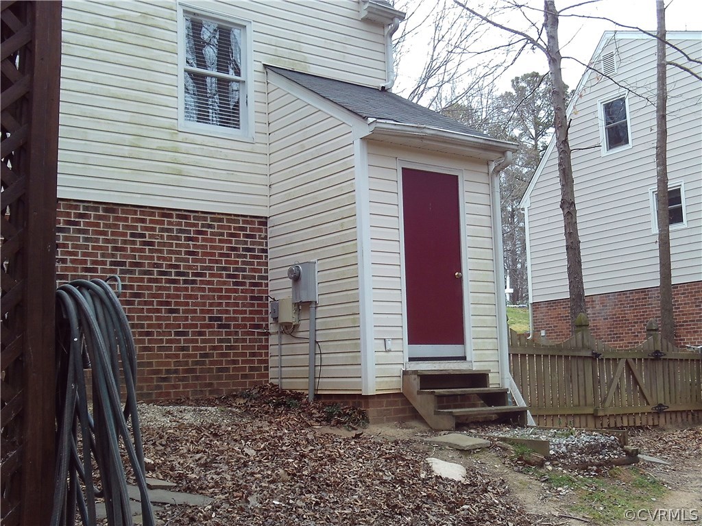 7029 Pointer Ridge Road Midlothian, VA 23112 - Photo 25 of 27 a view of a house with a yard and wooden fence
