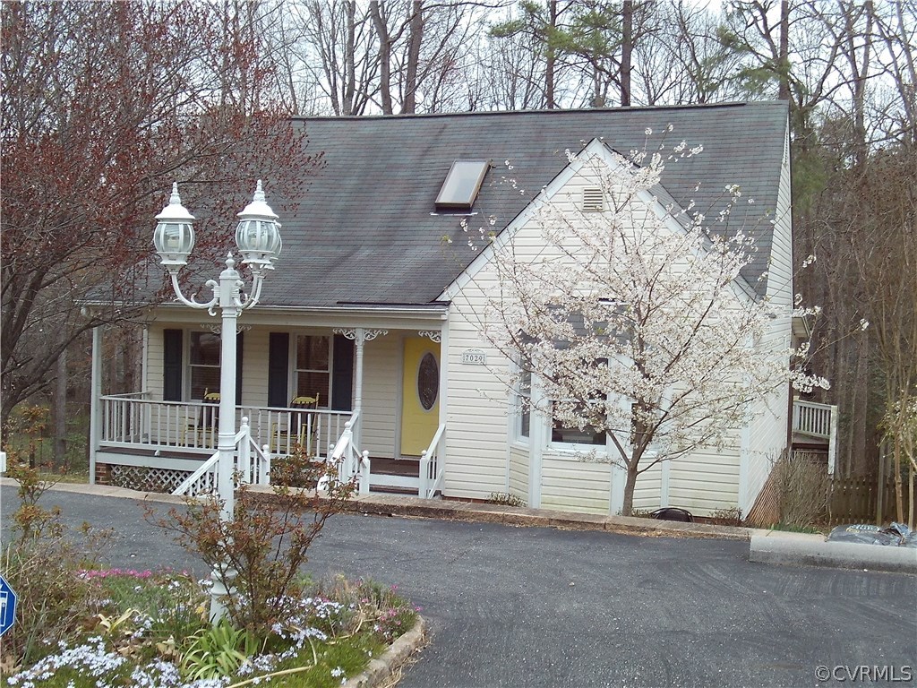7029 Pointer Ridge Road Midlothian, VA 23112 - Photo 3 of 27 a front view of a house with garden