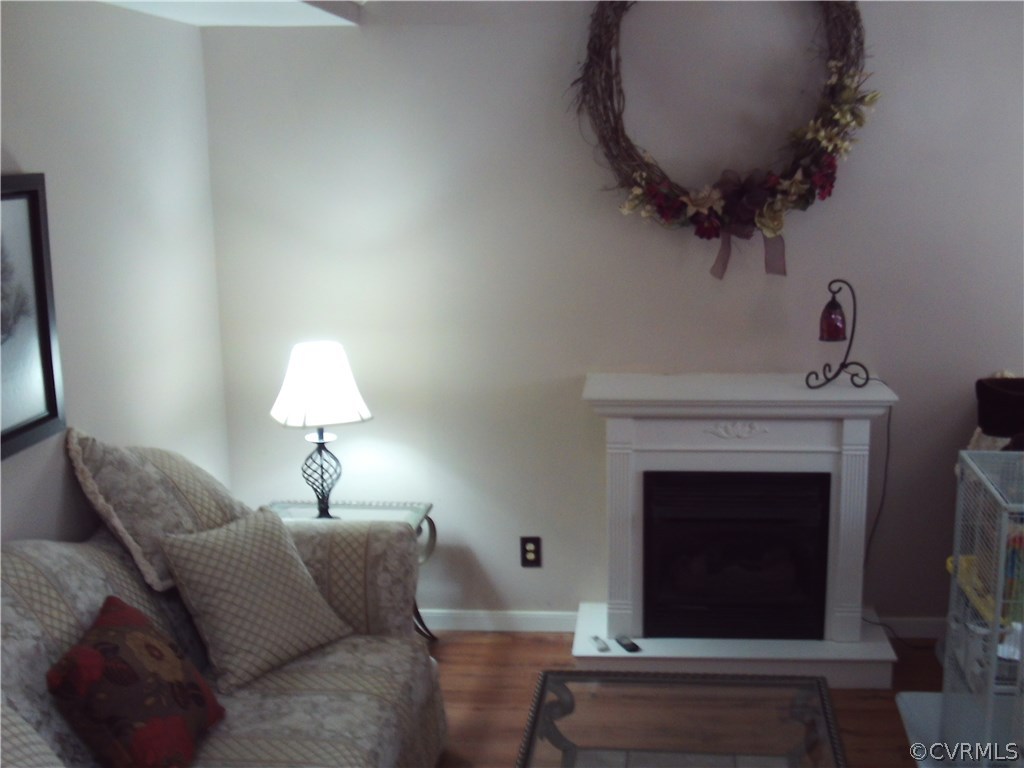 7029 Pointer Ridge Road Midlothian, VA 23112 - Photo 4 of 27 a living room with furniture and a fireplace