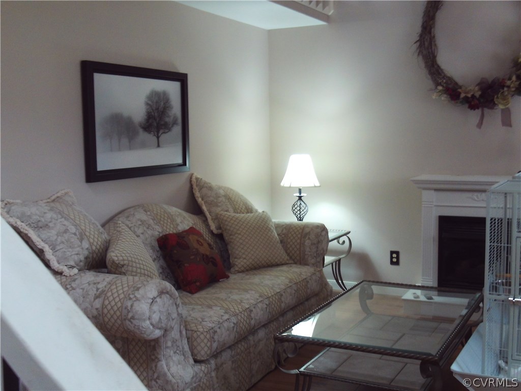 7029 Pointer Ridge Road Midlothian, VA 23112 - Photo 5 of 27 a living room with furniture and a fireplace