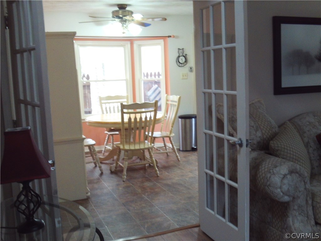 7029 Pointer Ridge Road Midlothian, VA 23112 - Photo 8 of 27 a dining room with furniture and window