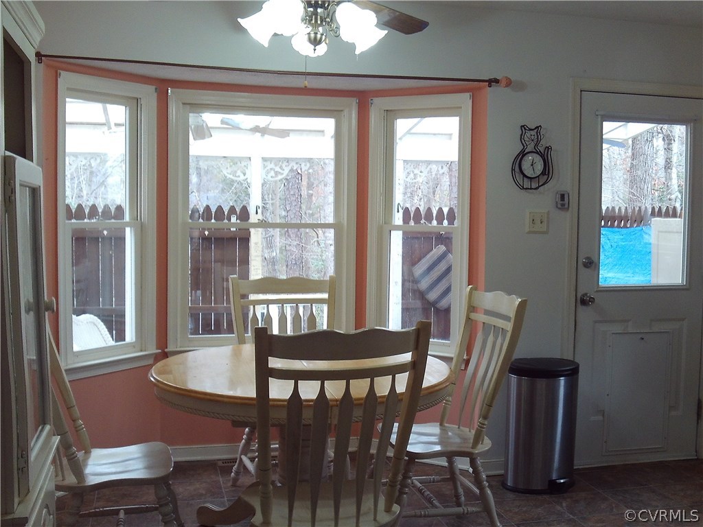 7029 Pointer Ridge Road Midlothian, VA 23112 - Photo 9 of 27 a view of a dining room with furniture window and outside view