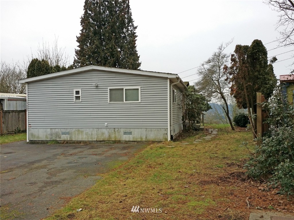 19007 126th Avenue Northeast Bothell, WA 98011 - Photo 1 of 15 a view of a house with a yard