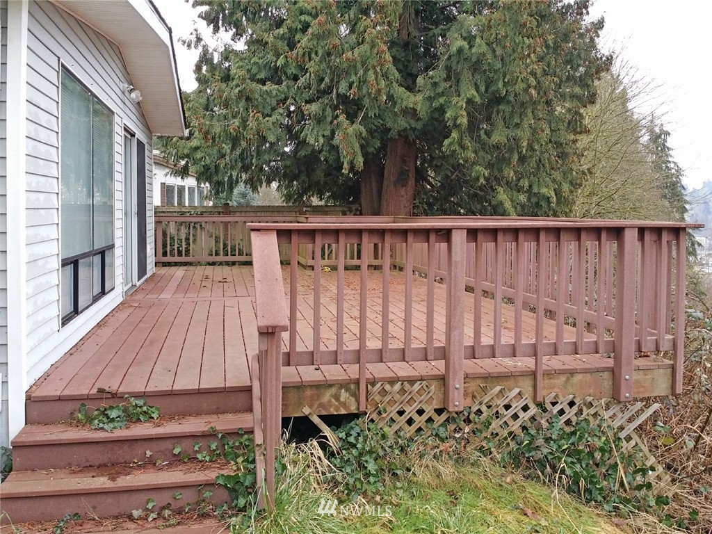 19007 126th Avenue Northeast Bothell, WA 98011 - Photo 13 of 15 a view of a wooden fence and a bench