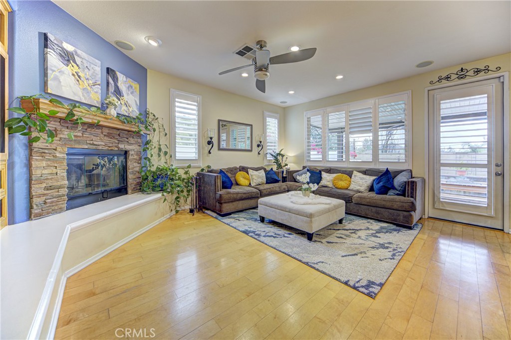 32185 Bandelier Road Winchester, CA 92596 - Photo 13 of 47 a bedroom with furniture and a fireplace