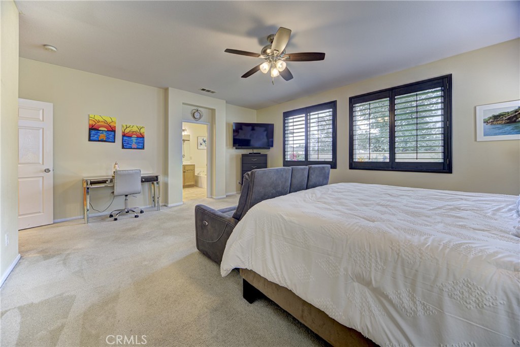 32185 Bandelier Road Winchester, CA 92596 - Photo 15 of 47 a spacious bedroom with a bed couches and window