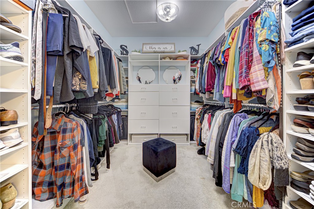 32185 Bandelier Road Winchester, CA 92596 - Photo 18 of 47 a view of walk in closet with clothes and shoes
