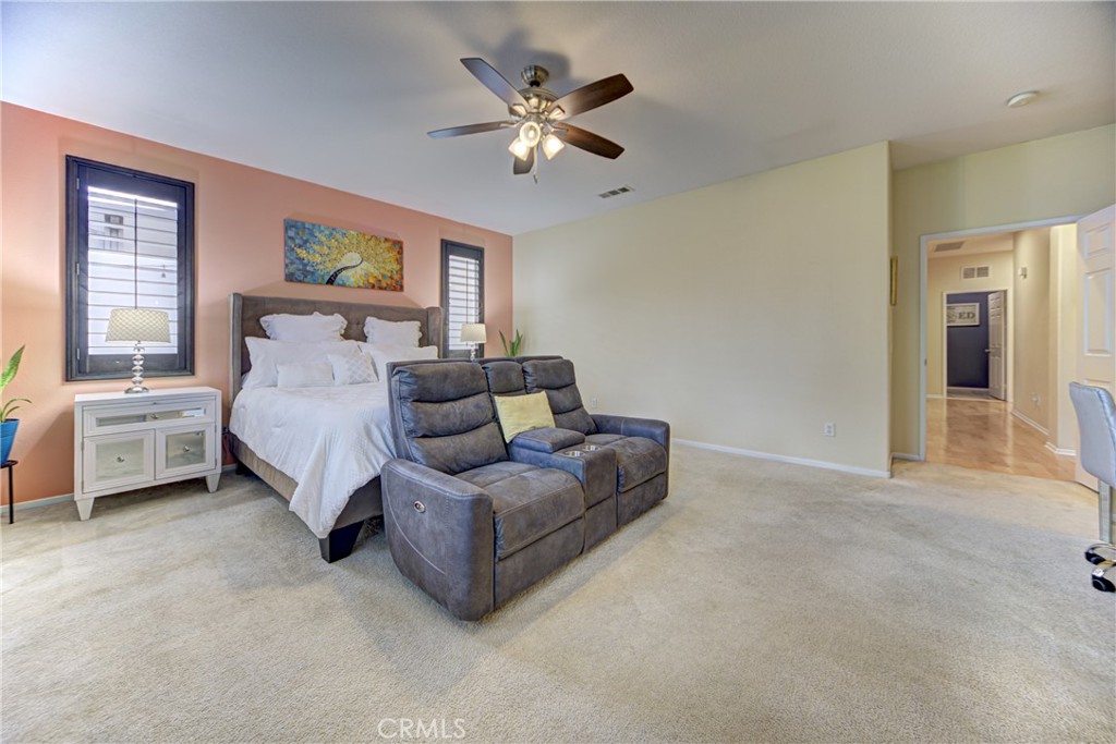 32185 Bandelier Road Winchester, CA 92596 - Photo 19 of 47 a bed room with a bed and a ceiling fan