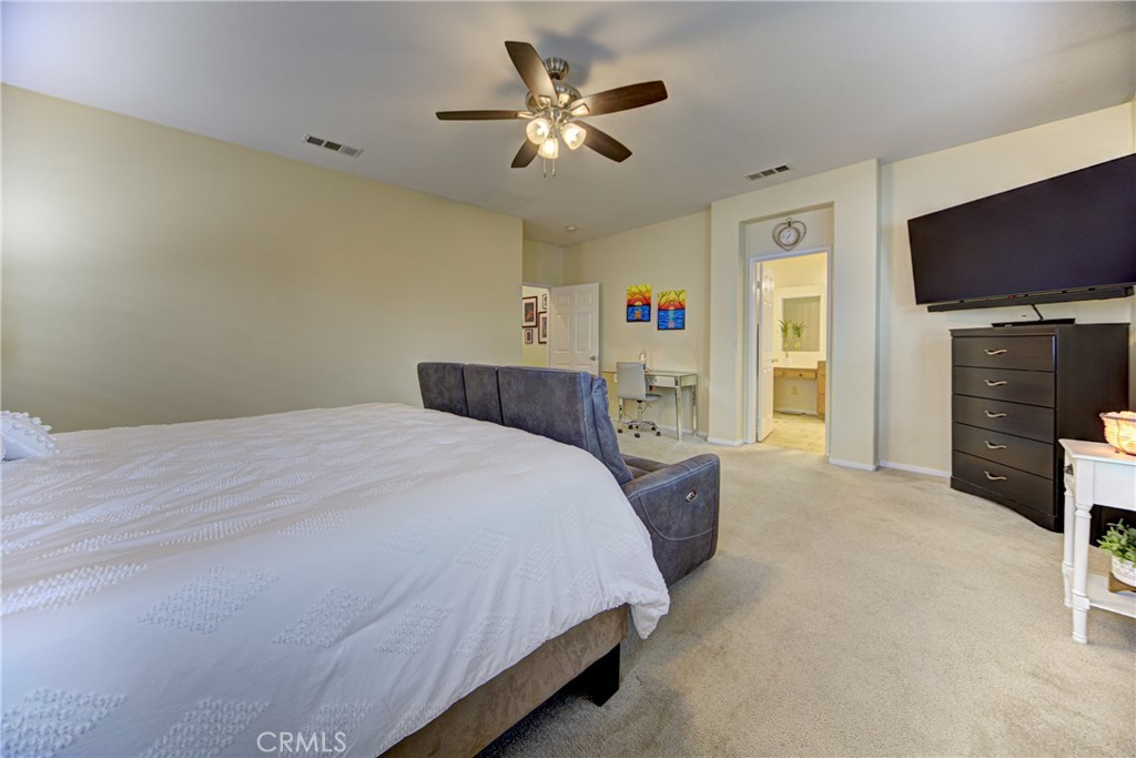 32185 Bandelier Road Winchester, CA 92596 - Photo 20 of 47 a bedroom with a bed and a flat screen tv