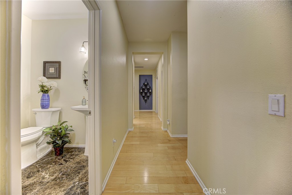 32185 Bandelier Road Winchester, CA 92596 - Photo 24 of 47 a view of a hallway with a potted plant
