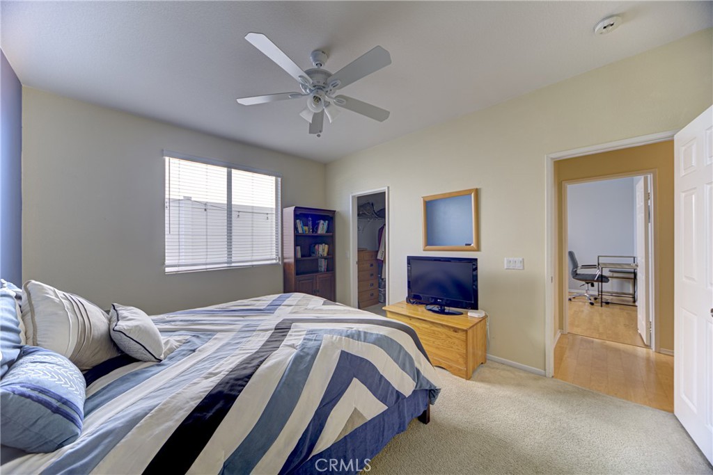 32185 Bandelier Road Winchester, CA 92596 - Photo 29 of 47 a bedroom with a bed and glass window