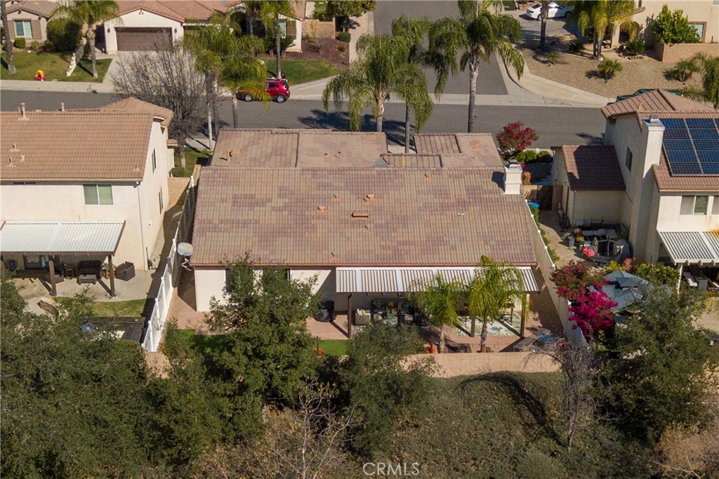 32185 Bandelier Road Winchester, CA 92596 - Photo 45 of 47 an aerial view of a house with a yard and a garage