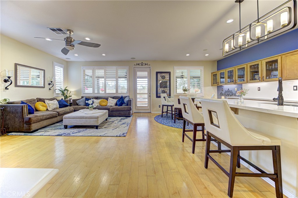 32185 Bandelier Road Winchester, CA 92596 - Photo 7 of 47 a living room with furniture and kitchen view