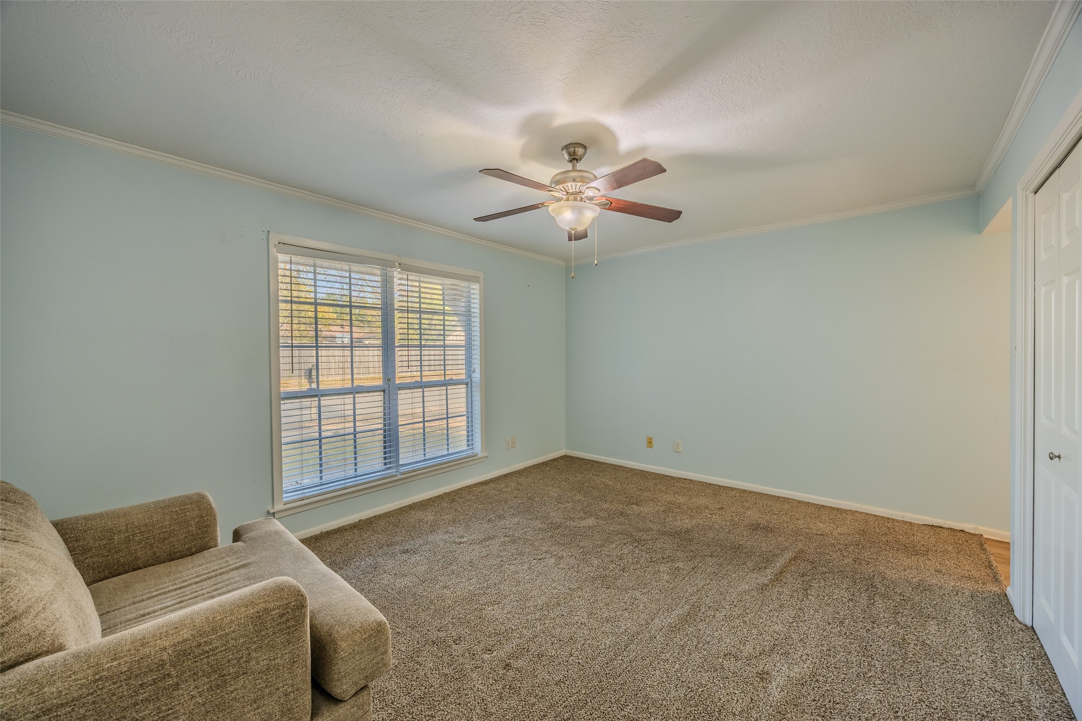 2002 South Lubbock Street Brenham, TX 77833 - Photo 19 of 26 a living room with furniture and a ceiling fan