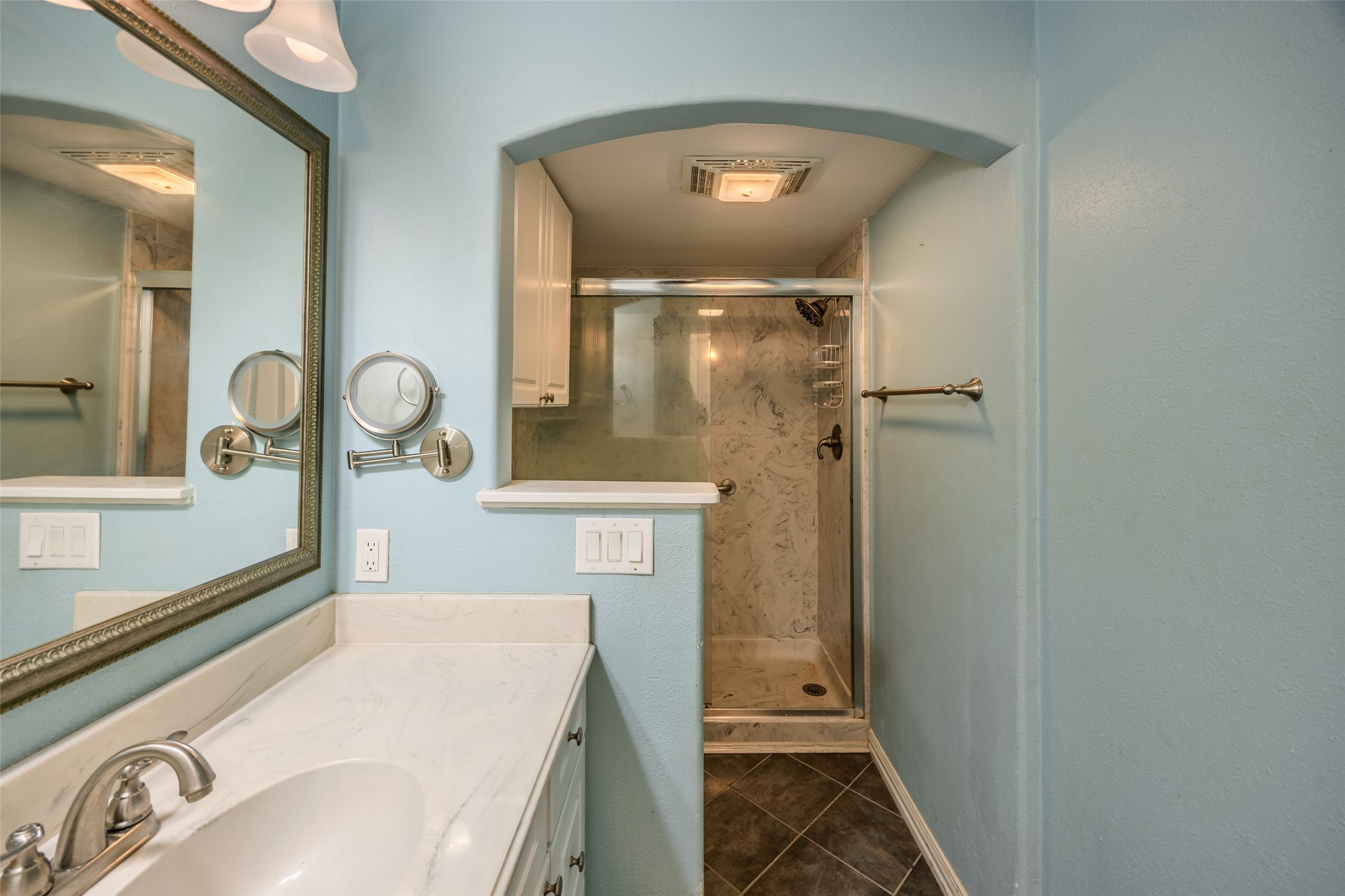 2002 South Lubbock Street Brenham, TX 77833 - Photo 20 of 26 a bathroom with a sink and mirror