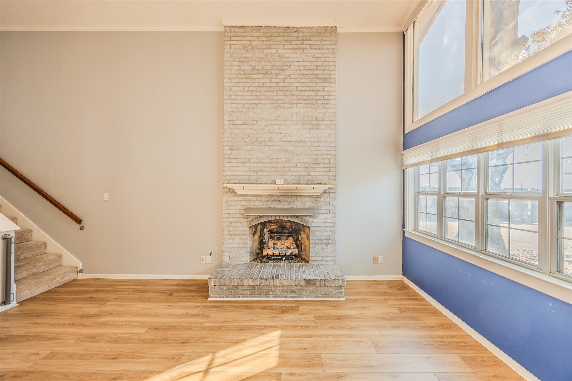 2002 South Lubbock Street Brenham, TX 77833 - Photo 8 of 26 a view of a livingroom with wooden floor and a fireplace