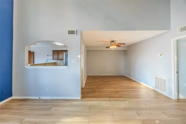 a kitchen with stainless steel appliances granite countertop a refrigerator a stove and a sink with cabinets