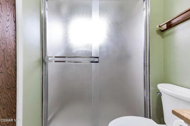 a view of a road with a building in the background