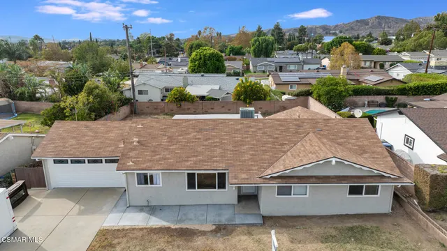 an aerial view of a house with outdoor space