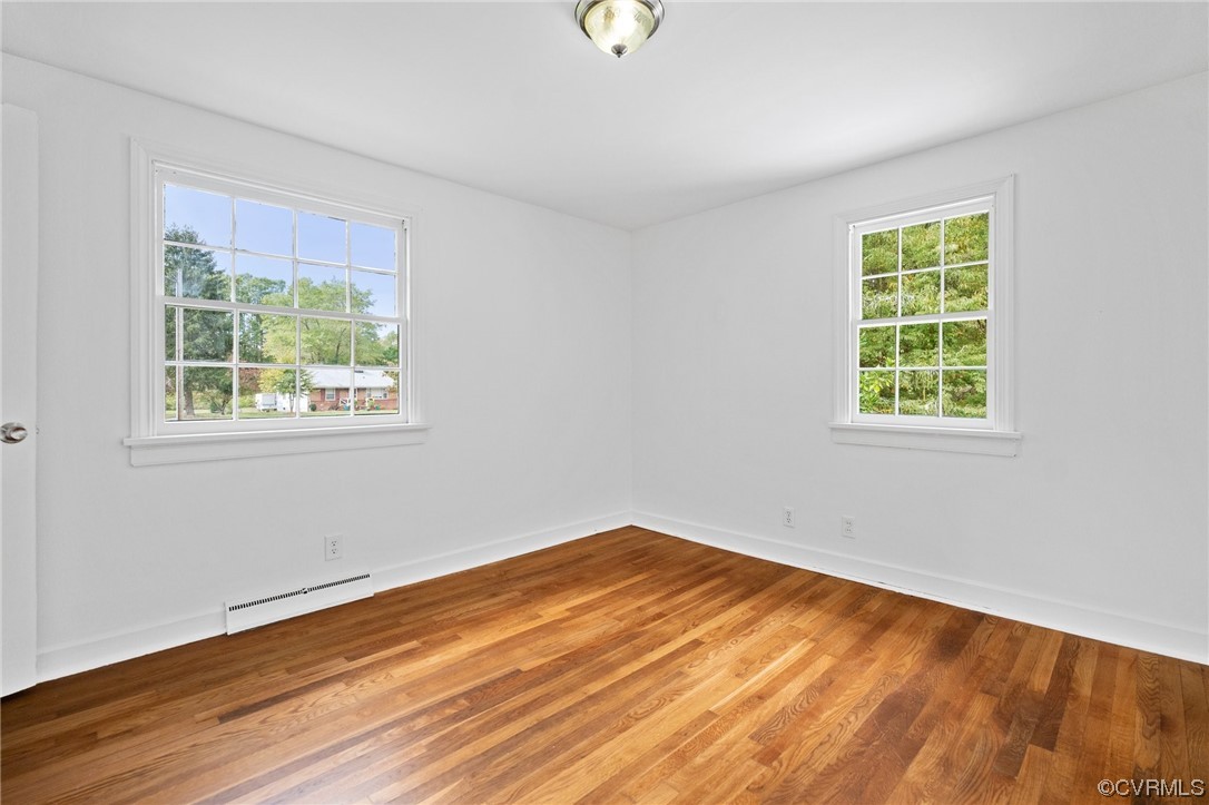 11252 Cauthorne Road Glen Allen, VA 23059 - Photo 22 of 45 a view of empty room with wooden floor and fan