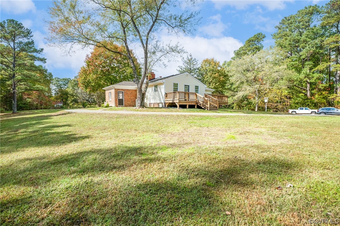 11252 Cauthorne Road Glen Allen, VA 23059 - Photo 37 of 45 a front view of a house with a garden and trees