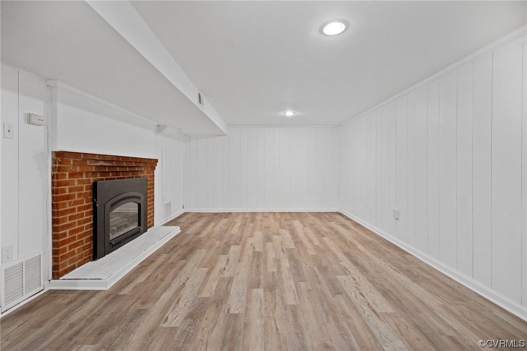 11252 Cauthorne Road Glen Allen, VA 23059 - Photo 9 of 45 a view of empty room with wooden floor and fireplace