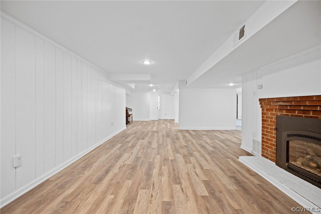 11252 Cauthorne Road Glen Allen, VA 23059 - Photo 10 of 45 a view of empty room with wooden floor and fireplace