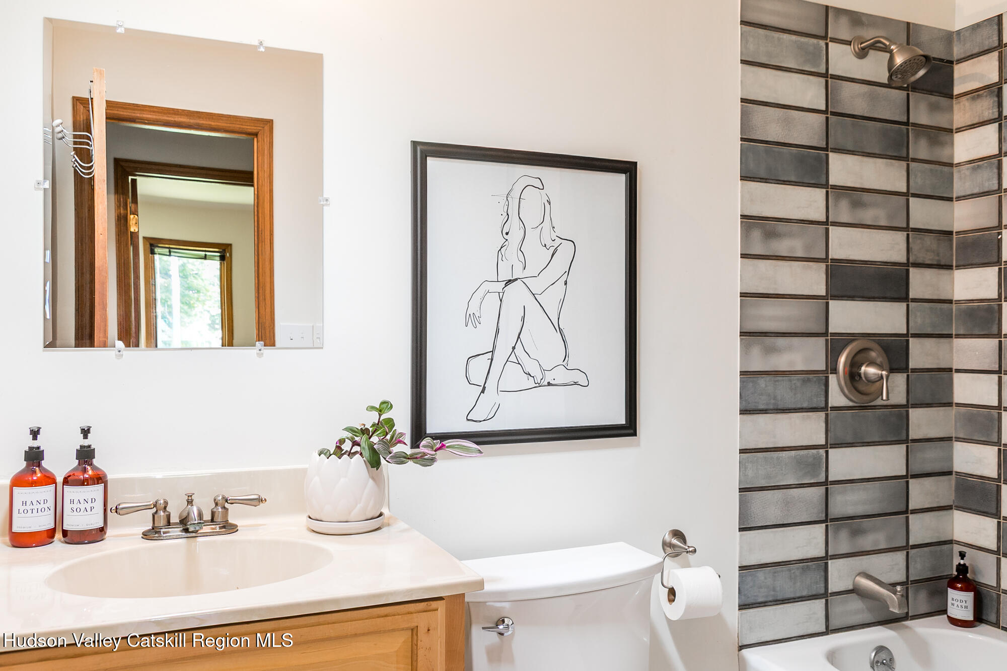 2 Romney Way Cottekill, NY 12419 - Photo 18 of 33 a bathroom with a sink a toilet and shower curtain