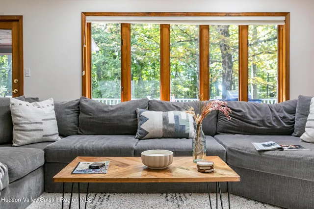 a living room with furniture and a window