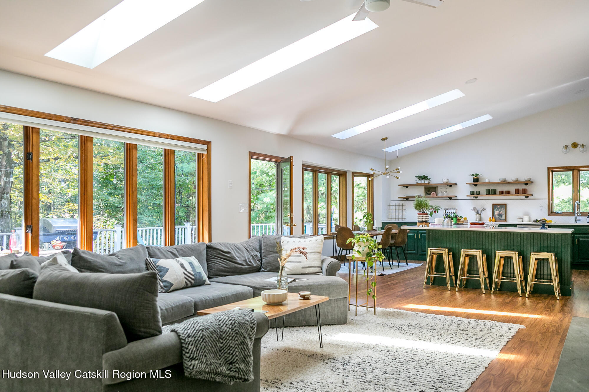 2 Romney Way Cottekill, NY 12419 - Photo 3 of 33 a living room with furniture a large window and a dining table