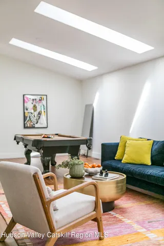 a living room with furniture and rug